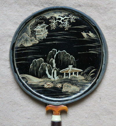 Circular Chinese hand mirror with inlaid decoration