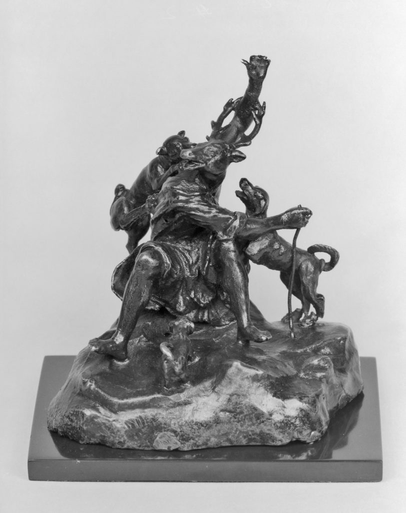 Bronze sculpture of the antlered Actaeon collapsing as his hounds climb his body.