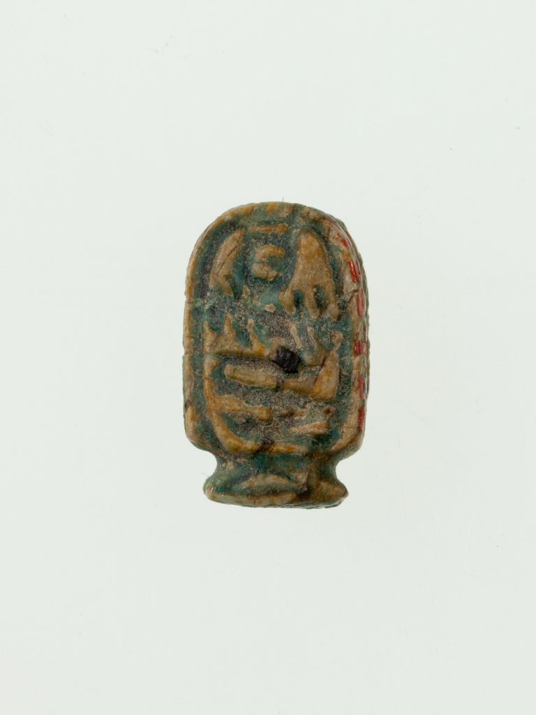 Small glazed steatite cartouche plaque bearing carved royal hieroglyphs.
